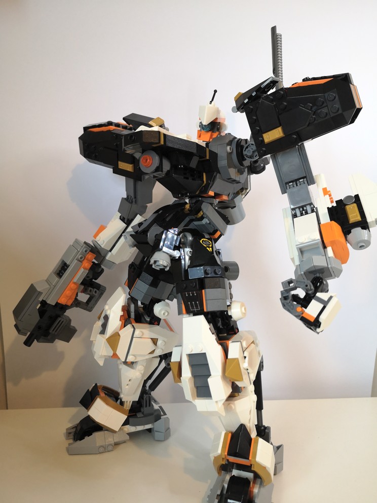 An enormous lego model of an Armored Core. At its side, it lazily holds a short machine gun that would be more than twice as long as the pilot is tall, were the model full size. Its head is cocked inquisitively at you, sizing you up. Will it need to raise its weapon?