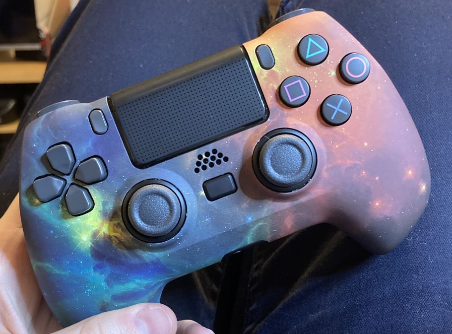 A modified PlayStation 4 controller with a pretty nebula skin.