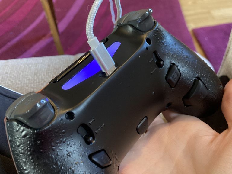 My modified controller with a cable inserted into the USB-C port.