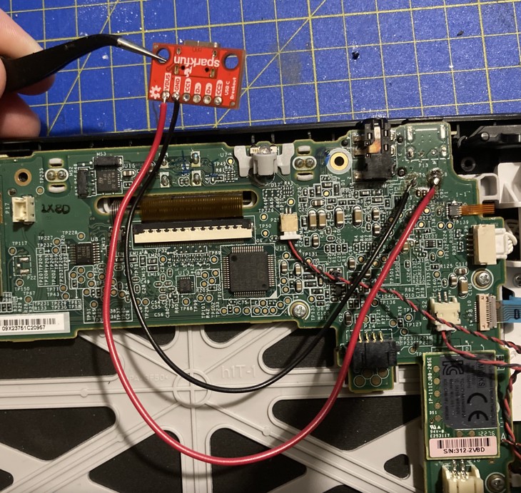 Photo of the USB-C breakout board connected via wire to the power pads on the motherboard.