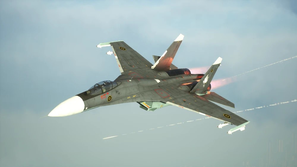 A SU-27 flies through the air, painted in a dark grey Sicario livery.